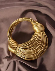 Gold Luxury Designer Brand Handwoven Noodle Clutch.