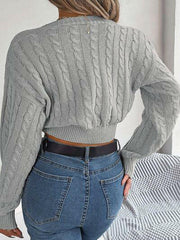 Twisted Cable-Knit V-Neck Sweater.